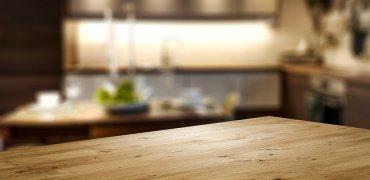 A picture containing indoor, wooden, wood, table Description automatically generated